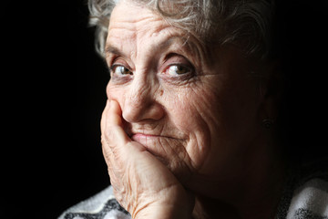 Grandmother portrait on a black background