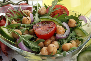 Healthy homemade chickpea and veggies salad, arugula, diet, vegetarian, vegan food, vitamin snack