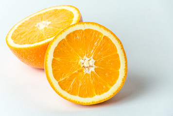 Fresh orange fruit in a cut, macro close up photo. Healthy and natural food 