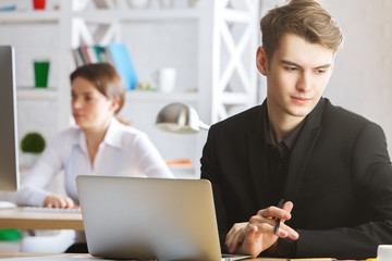 Caucasian man using laptop
