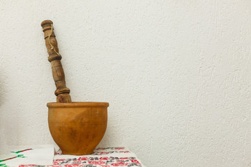wooden mortar and pestle isolated on white background