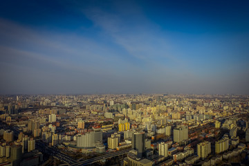 Obraz premium BEIJING, CHINA - 29 JANUARY, 2017: Incredible views over capitol city from top of old CCTV tower, buildings visible as far as you can see, nice blue sky