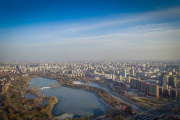 BEIJING, CHINA - 29 JANUARY, 2017: Incredible views over capitol city from top of old CCTV tower, buildings visible as far as you can see, nice blue sky