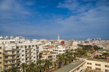 Aerial cityscape of Casablanca with view on the Mosque Hassan II - Morocco - beautiful Panorama with palm tree avenue in the foreground
