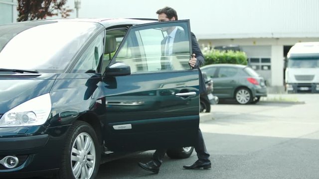 Man getting into car