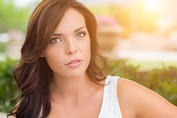 Fototapeta premium Pensive Mixed Race Girl Portrait Outdoors at the Park.