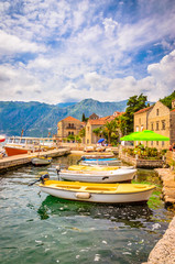 beautiful mediterranean landscape. Mountains and fishing boats near town Perast, Kotor bay (Boka...