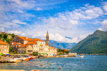 beautiful mediterranean landscape. Mountains and fishing boats near town Perast, Kotor bay (Boka...