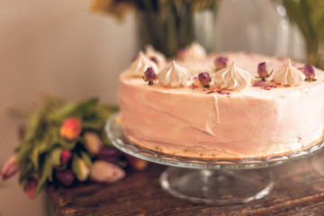 Beautiful cake and spring flowers