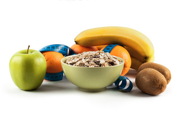 Muesli in bowl and fresh fruits