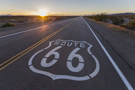 Route 66 highway sign sunset in the California Mojave Desert.  