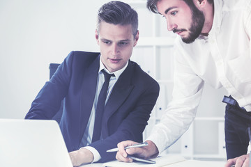 Man is showing a line to coworker