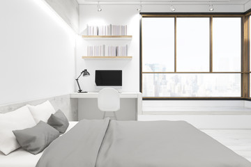White bedroom interior with computer