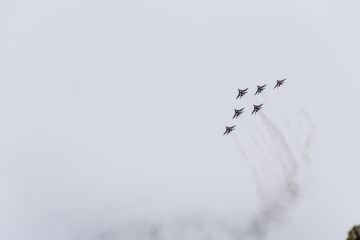Air show in the sky above the Krasnodar airport flight school. Airshow in honor of Defender of the Fatherland. MiG-29 in the sky.