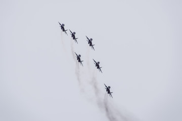 Air show in the sky above the Krasnodar airport flight school. Airshow in honor of Defender of the...