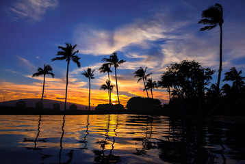 Hawaiian sunset over pool