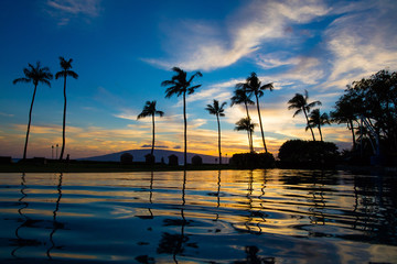 Blue hawaiian sunset over pool