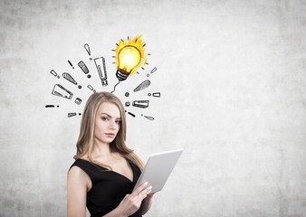 Woman with tablet and exclamations, bulb