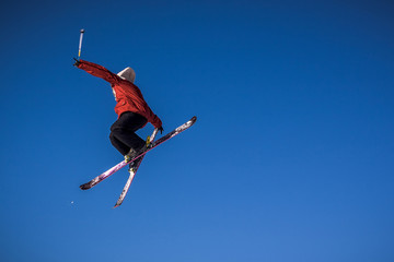 Fototapeta na wymiar Skier doing jump tricks