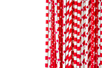 red paper straws on white background