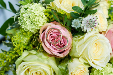 wedding bouquet with roses and rings