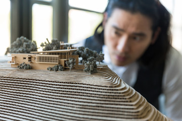 Close up architectural model of residential building and landscape terrain topography design