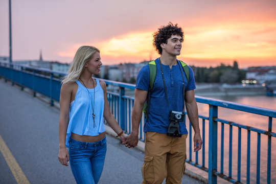 Couple of tourist enjoy the vacation. Romantic walk.