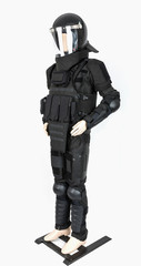 Mannequin dressed in a bulletproof tactical vest, protective elements on the feet and hands, police, defense, security guards and a helmet.