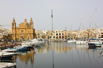 Parish Church at Msida marina with boats on Malta Island. 