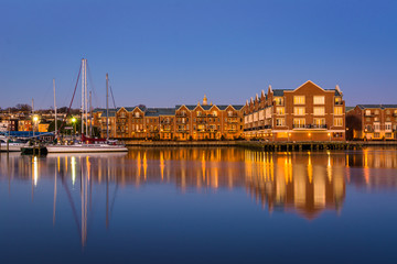 Buildings on the Canton Waterfront at twilight, in Baltimore, Maryland.