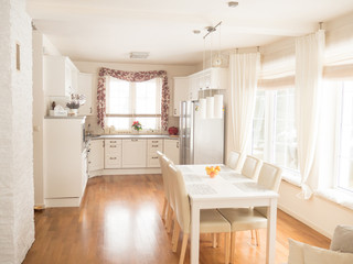 Kitchen interior with table and chairs.