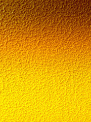 Yellow and orange painted textured bumpy background with space for text. Can be used as a background for Easter and other occasions.
