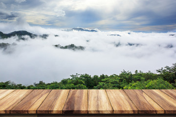 Wooden table with landscape background.
