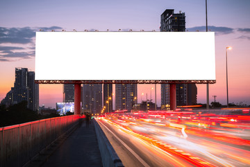 blank billboard on the street with light trails