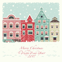 The cover of the card. Depicts a winter street with houses . The house of red, pink, green and beige colors.The phrase merry Christmas and a happy New year.