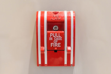 Push button switch fire alarm box on cement wall for warning and security system