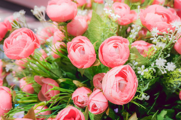 Rose-pink flowers decorate in basket, furnished house with beautiful flowers.