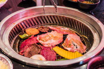 Mixed roasted meat and vegetable barbecue grill