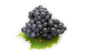 Black grapes bunch isolated on white background with green leaf package design element