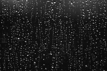 Naklejka na ściany i meble Rain drops on the window glass