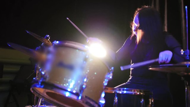 Teen rock music - gothic girl percussion drummer perform music break down