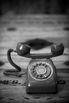 An old telephone with rotary dial
