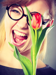Cheerful girl with flower.