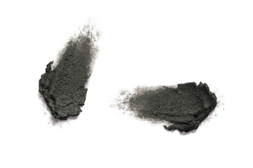Smudged black color cosmetic on background