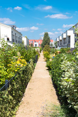 Fototapeta na wymiar Modern serial houses with gardens seen in Berlin, Germany