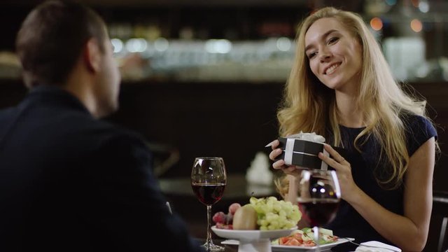 cute lady perceiving a gift to valentines day from man