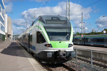Fototapeta premium Modern high-speed train at the platform of the railway station. Helsinki, Finland