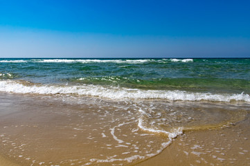 Peaceful ocean wave at beach.