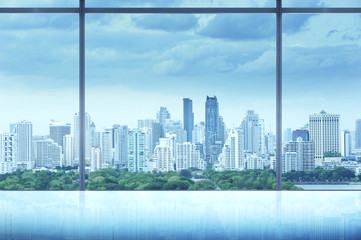Fototapeta na wymiar office interior with city view adjust to blue tone
