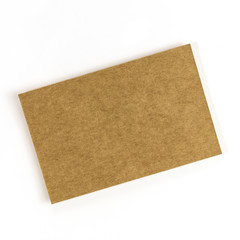 Brown kraft business card on white, blank for copyspace